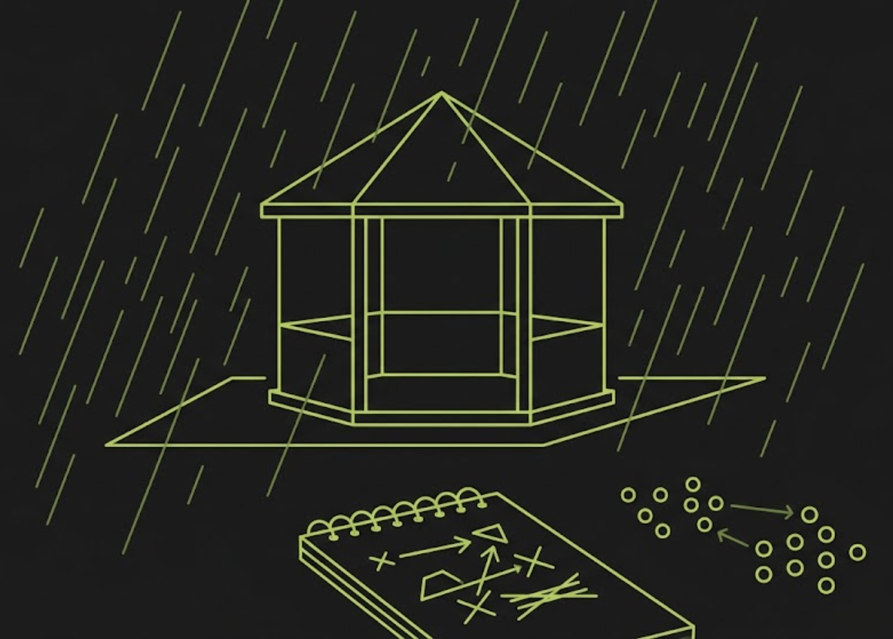 A coach re-working the line-up on a notepad under a gazebo in the rain